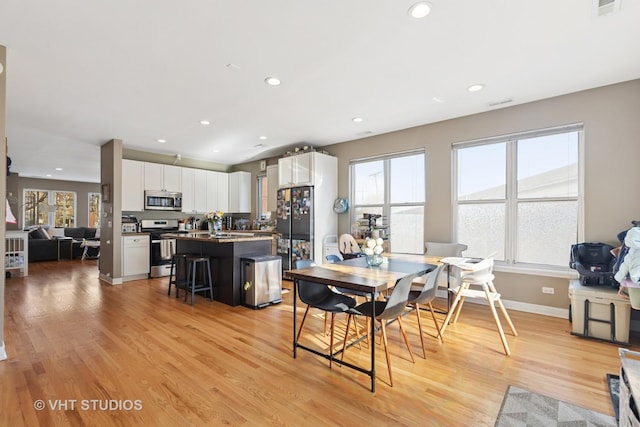 1845 N Marshfield Ave, Chicago, IL 60622 - dining room with healthy amount of natural light, light wood-style flooring, recessed lighting, and baseboards
