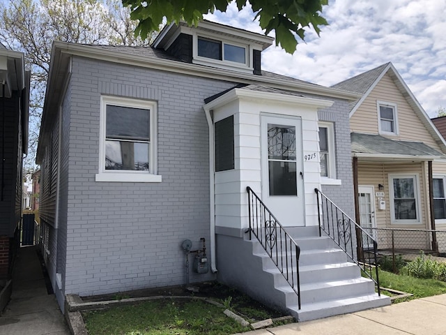 9715 S Ave N Ave, Chicago, IL 60617 - view of front facade with brick siding and entry steps