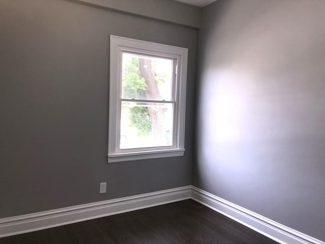 9715 S Ave N Ave, Chicago, IL 60617 - spare room with healthy amount of natural light, dark wood-type flooring, and baseboards