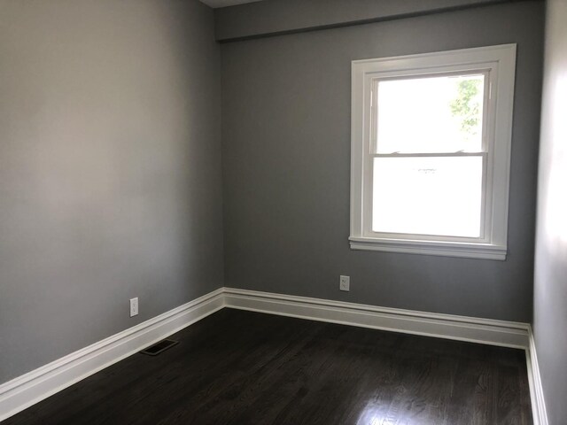 9715 S Ave N Ave, Chicago, IL 60617 - empty room with dark wood-type flooring and baseboards
