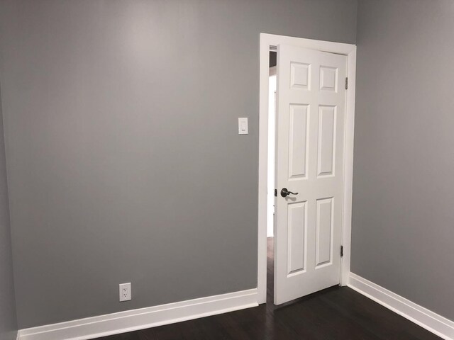 9715 S Ave N Ave, Chicago, IL 60617 - empty room with baseboards and dark wood finished floors