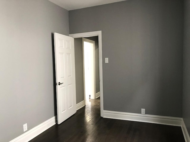 9715 S Ave N Ave, Chicago, IL 60617 - spare room with baseboards and dark wood-type flooring