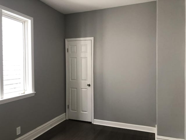 9715 S Ave N Ave, Chicago, IL 60617 - spare room with dark wood-style flooring and baseboards