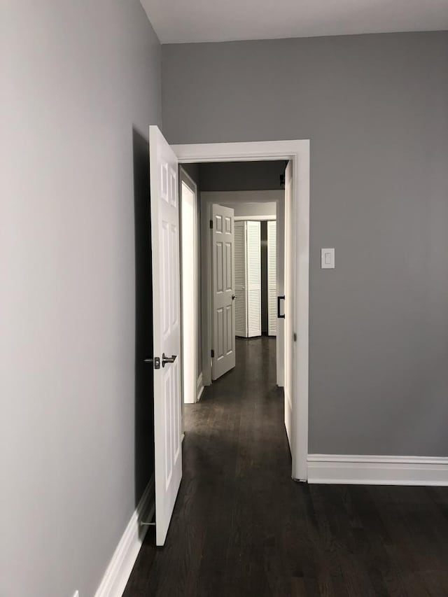 9715 S Ave N Ave, Chicago, IL 60617 - hallway featuring baseboards and dark wood-style floors