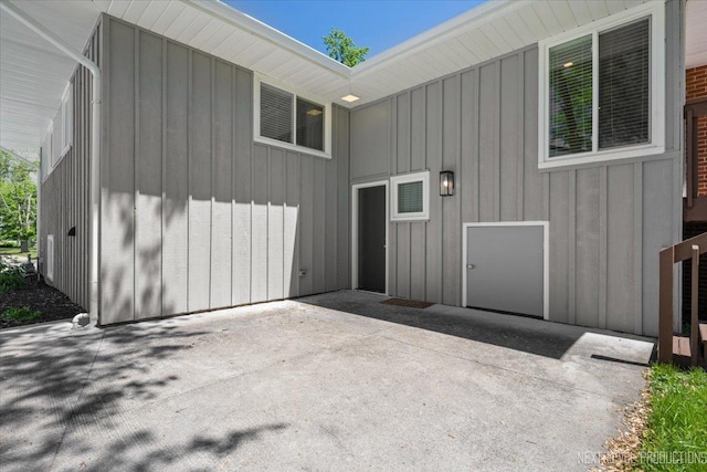 230 Elmwood Dr, Naperville, IL 60540 - entrance to property with board and batten siding and a patio