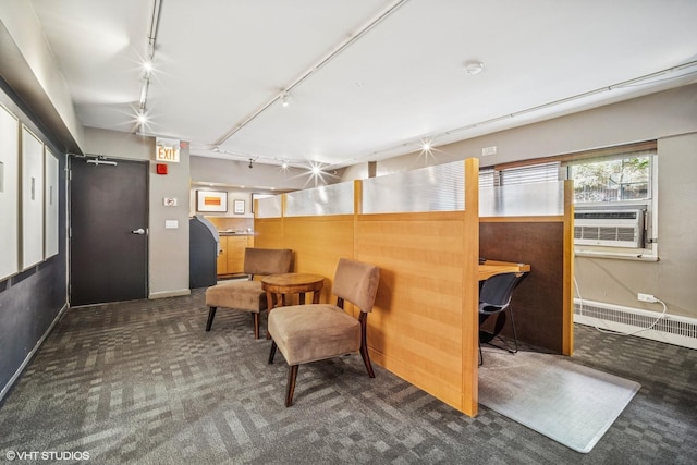 living area with rail lighting, carpet flooring, a baseboard heating unit, cooling unit, and baseboards