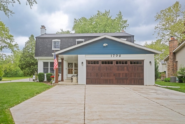 1706 Childs St, Wheaton, IL 60187 - view of front of house featuring a front lawn, a garage, driveway, cooling unit, and a chimney