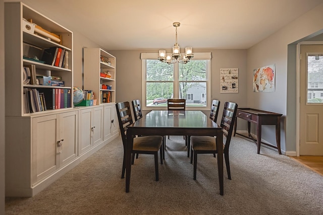1706 Childs St, Wheaton, IL 60187 - carpeted dining area with a chandelier and baseboards