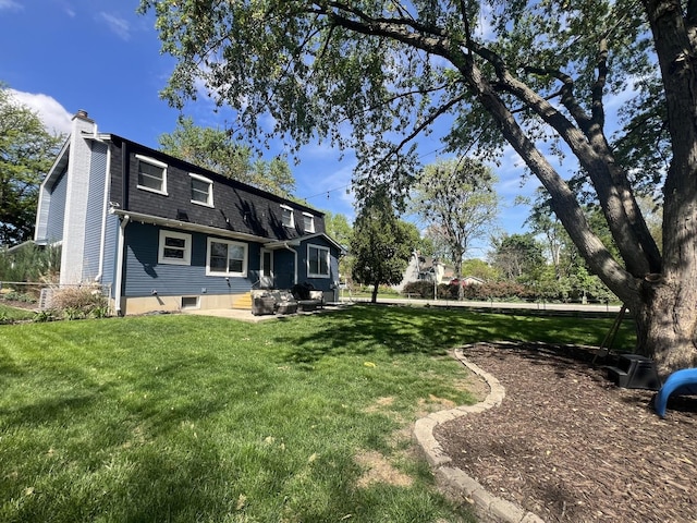 1706 Childs St, Wheaton, IL 60187 - back of house with a lawn, a chimney, and roof with shingles