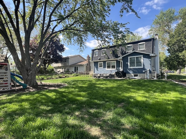 1706 Childs St, Wheaton, IL 60187 - rear view of house featuring a chimney and a playground