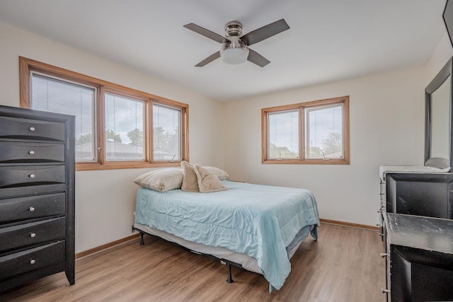 8440 Anvil Pl, Tinley Park, IL 60487 - bedroom with baseboards, light wood finished floors, and a ceiling fan