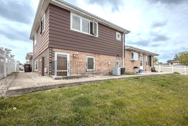 8440 Anvil Pl, Tinley Park, IL 60487 - rear view of house featuring brick siding, a patio, and cooling unit