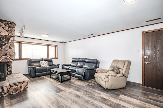 8440 Anvil Pl, Tinley Park, IL 60487 - living area featuring wood finished floors, a stone fireplace, and crown molding