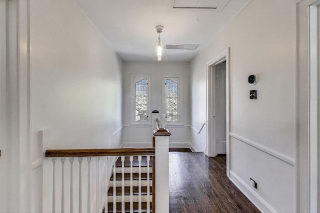 foyer entrance featuring dark wood-type flooring and baseboards