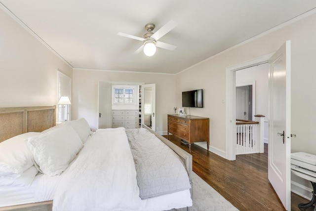 bedroom featuring wood finished floors, crown molding, and a ceiling fan