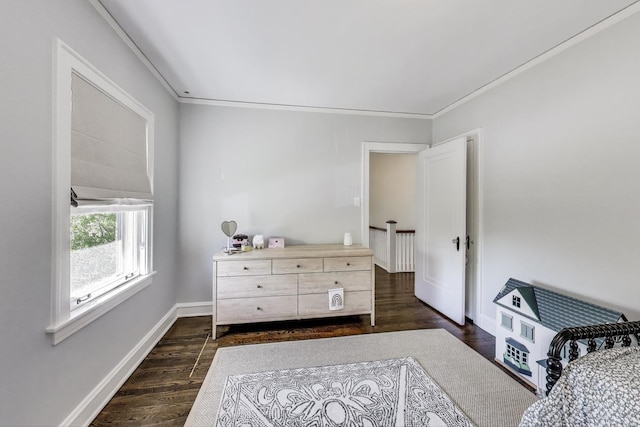 bedroom featuring dark wood-style floors, ornamental molding, and baseboards