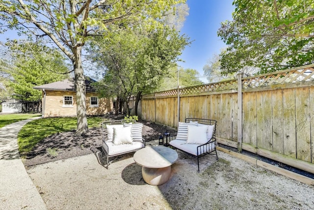 view of patio featuring a fenced backyard and an outbuilding