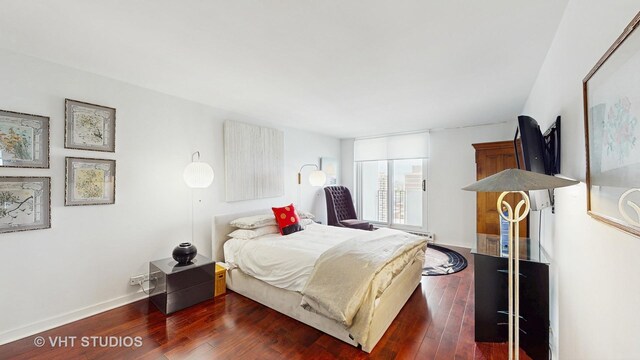 6033 N Sheridan Rd Unit 27B, Chicago, IL 60660 - bedroom with dark wood-type flooring and baseboards