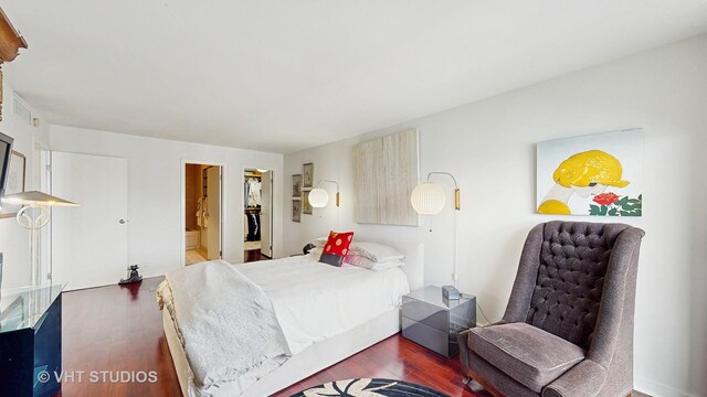 6033 N Sheridan Rd Unit 27B, Chicago, IL 60660 - bedroom with wood finished floors, a walk in closet, and connected bathroom