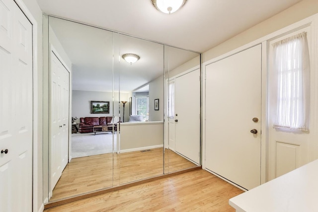 entrance foyer featuring light wood finished floors