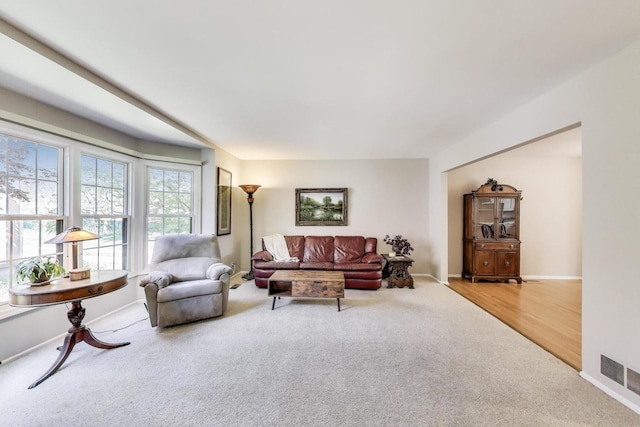living room with carpet floors and baseboards