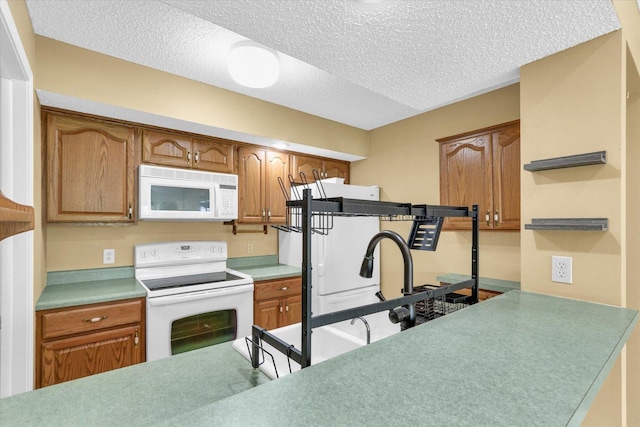 1109 Pomona Dr Unit 1109, Champaign, IL 61822 - kitchen featuring white appliances, a textured ceiling, brown cabinetry, open shelves, and light countertops