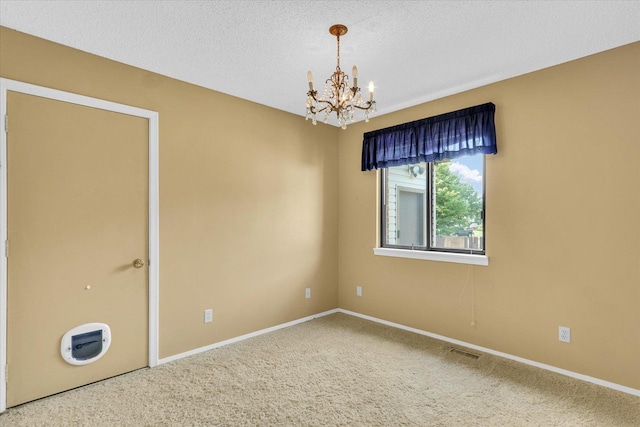 1109 Pomona Dr Unit 1109, Champaign, IL 61822 - carpeted spare room featuring a chandelier and a textured ceiling