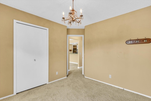 1109 Pomona Dr Unit 1109, Champaign, IL 61822 - unfurnished bedroom with carpet and a chandelier