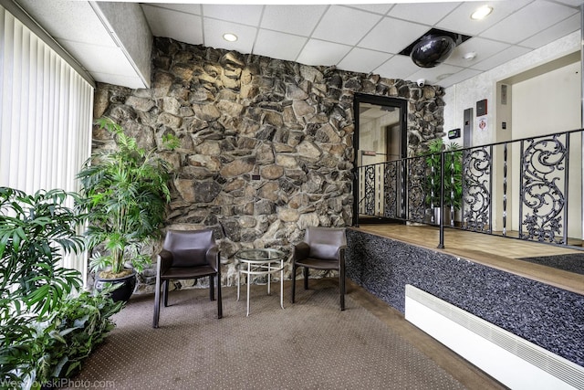 lobby with a paneled ceiling