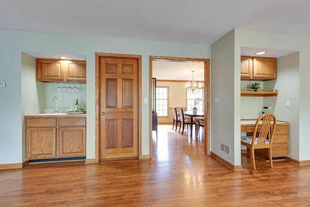 337 S Harrison Ct, Palatine, IL 60067 - indoor wet bar with a chandelier, light wood-style flooring, baseboards, and recessed lighting
