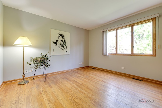337 S Harrison Ct, Palatine, IL 60067 - unfurnished room with wood finished floors and baseboards