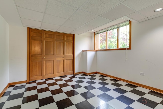337 S Harrison Ct, Palatine, IL 60067 - unfurnished bedroom featuring dark floors, baseboards, a paneled ceiling, and a closet