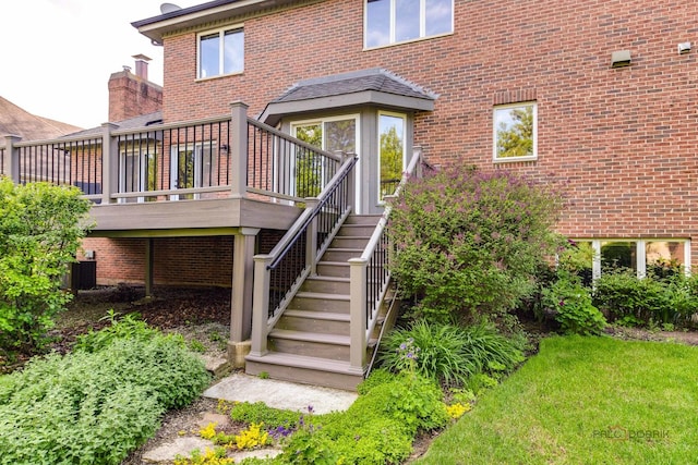337 S Harrison Ct, Palatine, IL 60067 - back of property featuring brick siding, central AC unit, a deck, and stairway
