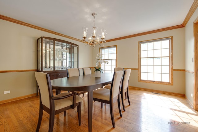 337 S Harrison Ct, Palatine, IL 60067 - dining room with baseboards, a chandelier, light wood-type flooring, and ornamental molding