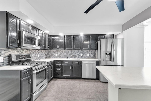 1903 Alton Dr, Champaign, IL 61821 - kitchen with appliances with stainless steel finishes, a sink, ceiling fan, and tasteful backsplash