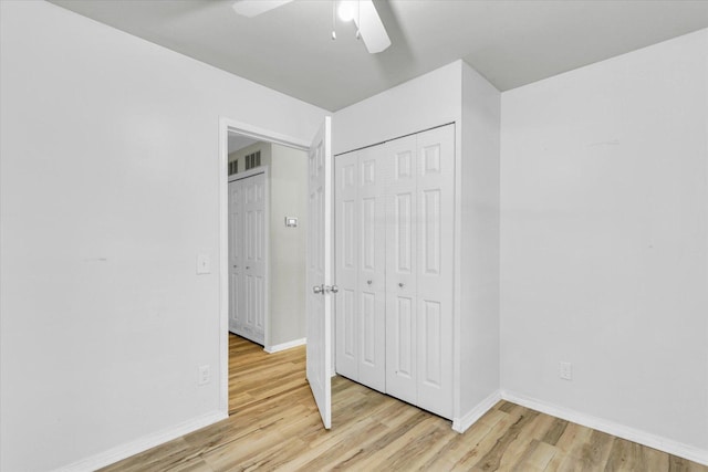 1903 Alton Dr, Champaign, IL 61821 - unfurnished bedroom featuring light wood-style flooring, baseboards, a closet, and a ceiling fan
