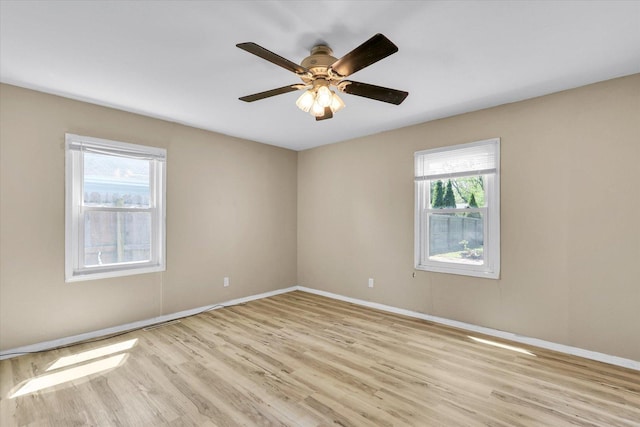 1903 Alton Dr, Champaign, IL 61821 - unfurnished room with light wood-style floors, baseboards, and a ceiling fan
