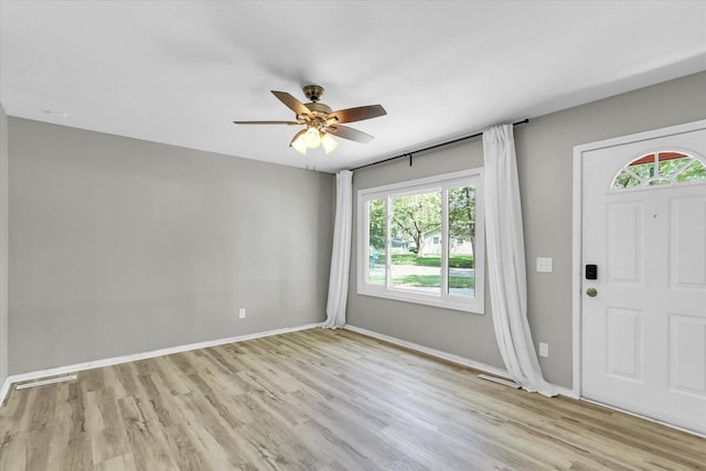 1903 Alton Dr, Champaign, IL 61821 - foyer featuring wood finished floors, ceiling fan, and baseboards