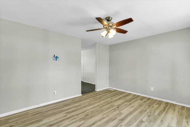 1903 Alton Dr, Champaign, IL 61821 - spare room with wood finished floors, ceiling fan, and baseboards