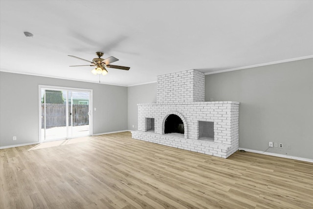 1903 Alton Dr, Champaign, IL 61821 - unfurnished living room featuring crown molding, ceiling fan, wood finished floors, a brick fireplace, and baseboards