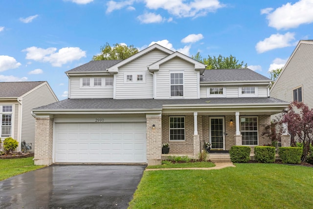 2990 Melbourne Ln, Lake In The Hills, IL 60156 - view of front of property featuring brick siding, driveway, a front lawn, covered porch, and roof with shingles
