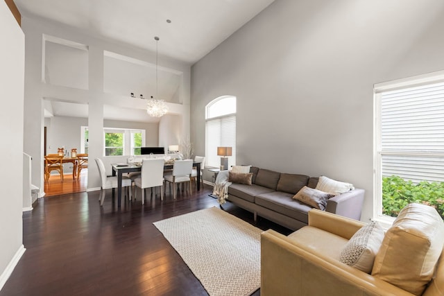 2990 Melbourne Ln, Lake In The Hills, IL 60156 - living room featuring high vaulted ceiling, a chandelier, dark wood finished floors, and baseboards