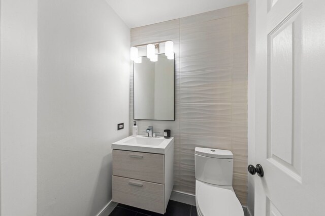 2990 Melbourne Ln, Lake In The Hills, IL 60156 - half bathroom with vanity, toilet, and baseboards