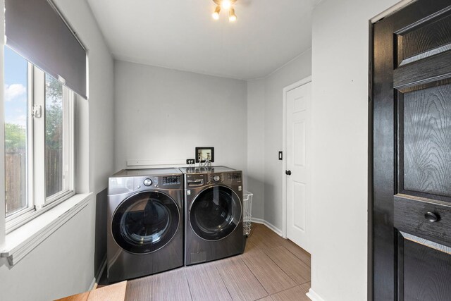 2990 Melbourne Ln, Lake In The Hills, IL 60156 - washroom with washing machine and clothes dryer, baseboards, and wood finished floors