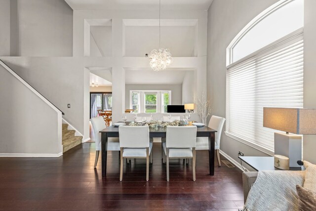 2990 Melbourne Ln, Lake In The Hills, IL 60156 - dining room featuring a high ceiling, a chandelier, stairway, wood finished floors, and baseboards