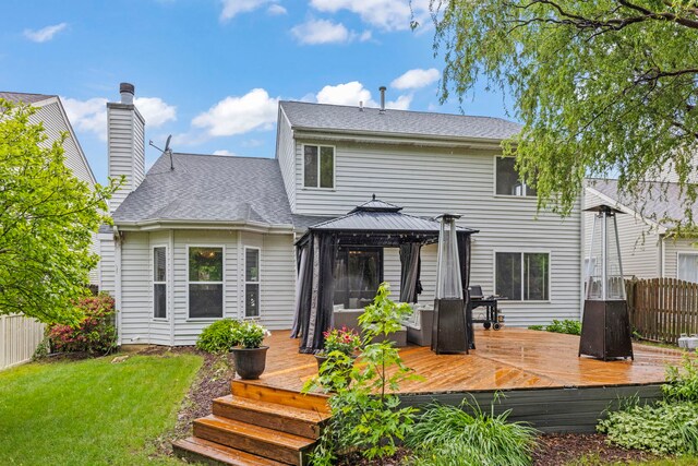 2990 Melbourne Ln, Lake In The Hills, IL 60156 - rear view of property featuring a gazebo, a chimney, a wooden deck, and roof with shingles