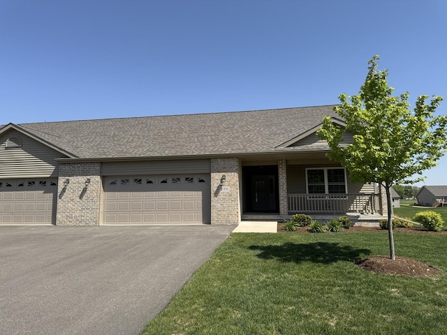 734 Keller Dr, Dixon, IL 61021 - single story home featuring an attached garage, driveway, brick siding, and a front lawn