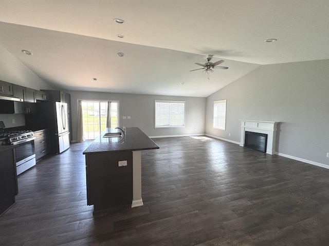 734 Keller Dr, Dixon, IL 61021 - kitchen with gas range, lofted ceiling, a sink, a ceiling fan, and dark wood-type flooring