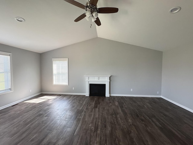 734 Keller Dr, Dixon, IL 61021 - unfurnished living room featuring ceiling fan, baseboards, a fireplace, lofted ceiling, and dark wood-style floors