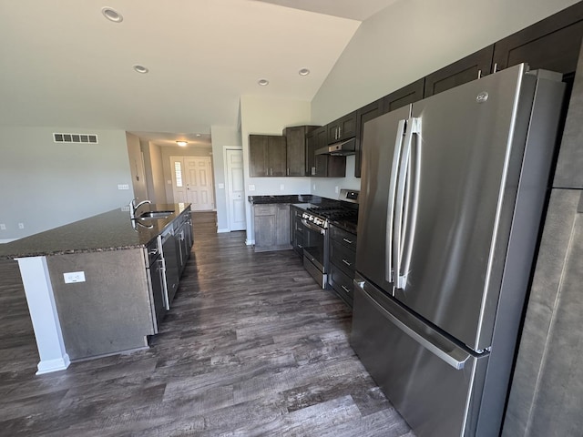 734 Keller Dr, Dixon, IL 61021 - kitchen with stainless steel appliances, a sink, dark wood-type flooring, lofted ceiling, and under cabinet range hood